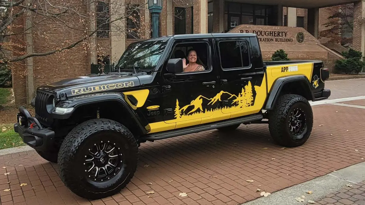 Jeep winner sitting in driver seat